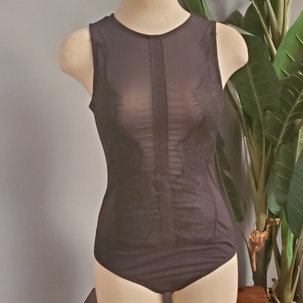All black lace and sheer body suit
